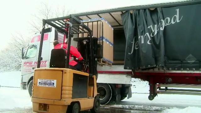forklift loading lorry with goods for export