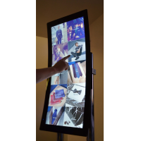 A curved touch screen using a custom size touch screen overlay