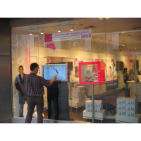 A touch screen through a shop window thanks to VisualPlanet, leading PCAP touch screen manufacturers.