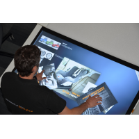 A man using a multi touch screen from leading touch foil manufacturers