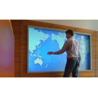 A man using a large PCAP screen from VisualPlanet, touch screen manufacturers