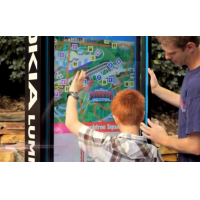 A VisualPlanet outdoor touch screen kiosk being used by a father and son