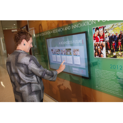 A woman using a projected capacitive touch film screen