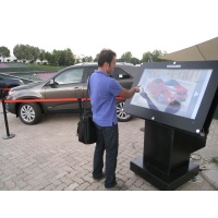 A man using an outdoor wash down touch screen