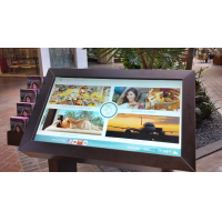 A self service touch screen kiosk with a PCAP foil