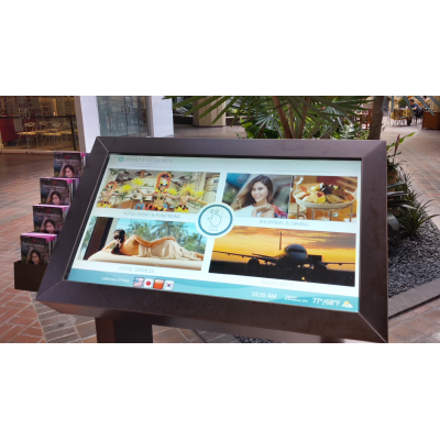 A self service touch screen kiosk with a PCAP foil