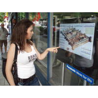 Multi touch screen overlay being used by woman