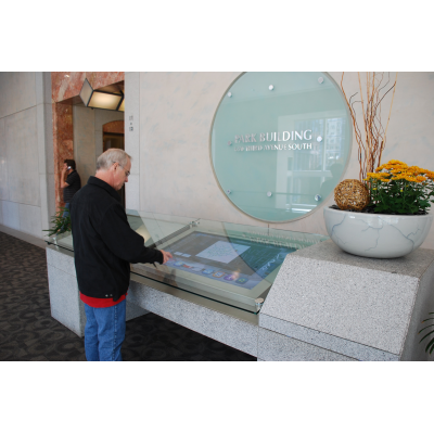 A man using a wash down touch screen