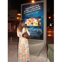 A woman using PCAP interactive digital signage