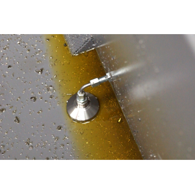 Machine tool coolant recovery kit in use in a swarf bin.