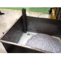 Machine tool coolant recovery in situ in a swarf bin.