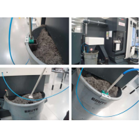 Machine coolant recycling equipment from Wogaard installed on a CNC machine.