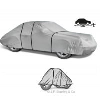 Breathable outdoor car cover protects vehicles during trailer transport.