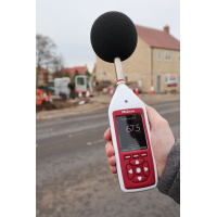 Bluetooth decibel meter being used for engine noise measurement.