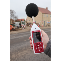 An Optimus+ decibel meter being used for environmental noise measurement.