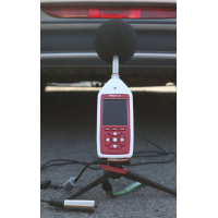 Bluetooth decibel meter measuring vehicle noise.