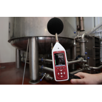 Occupational noise exposure monitor in use in an industrial workplace.