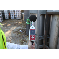 Bluetooth sound level meter being used for industrial acoustic measurement.